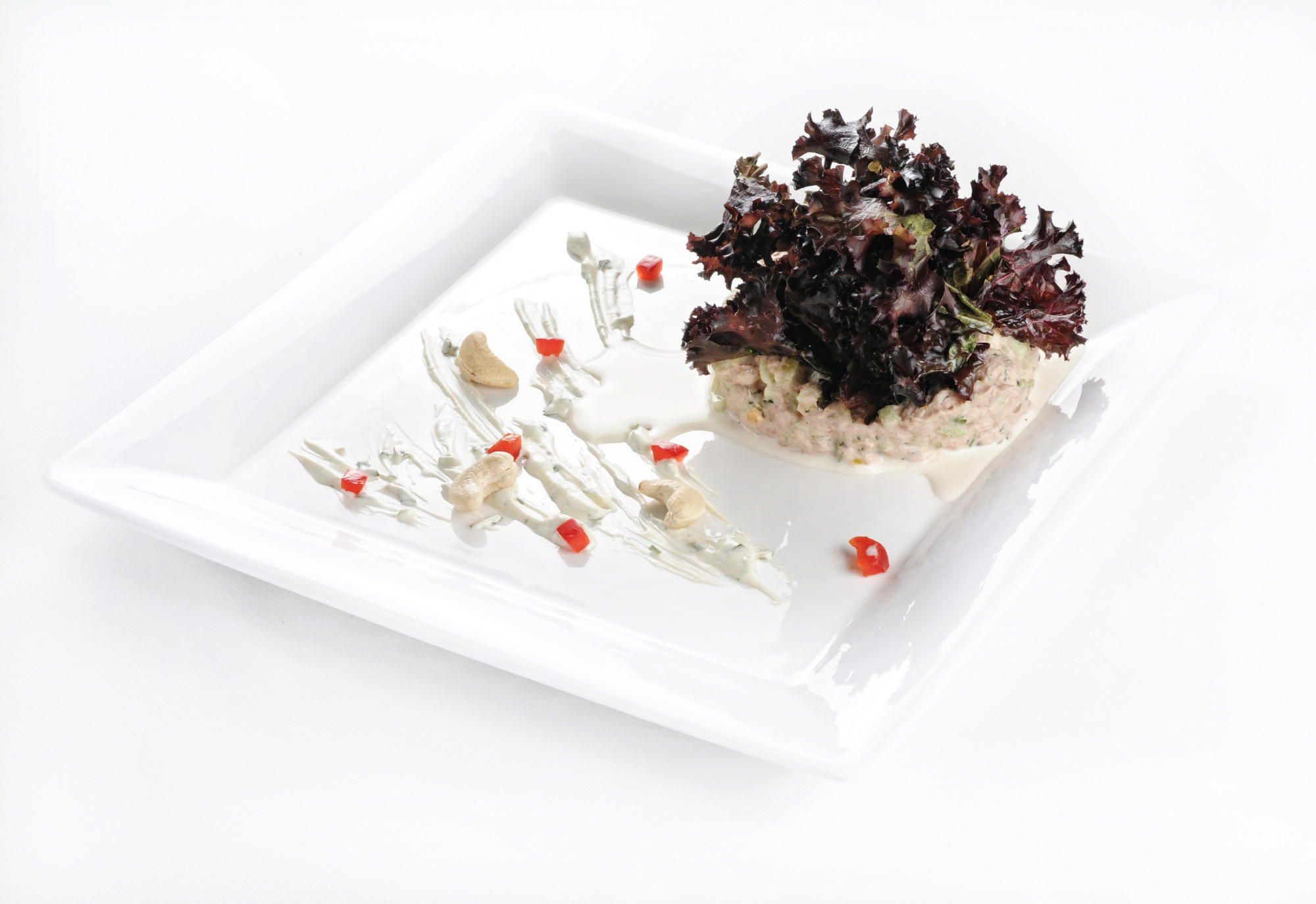 Finished dessert on ceramic plate with garnish